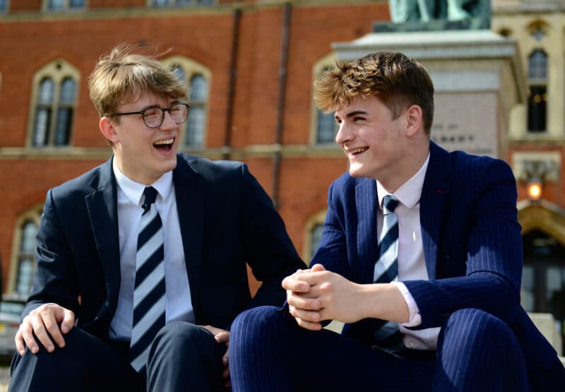 Two Senior school pupils laughing