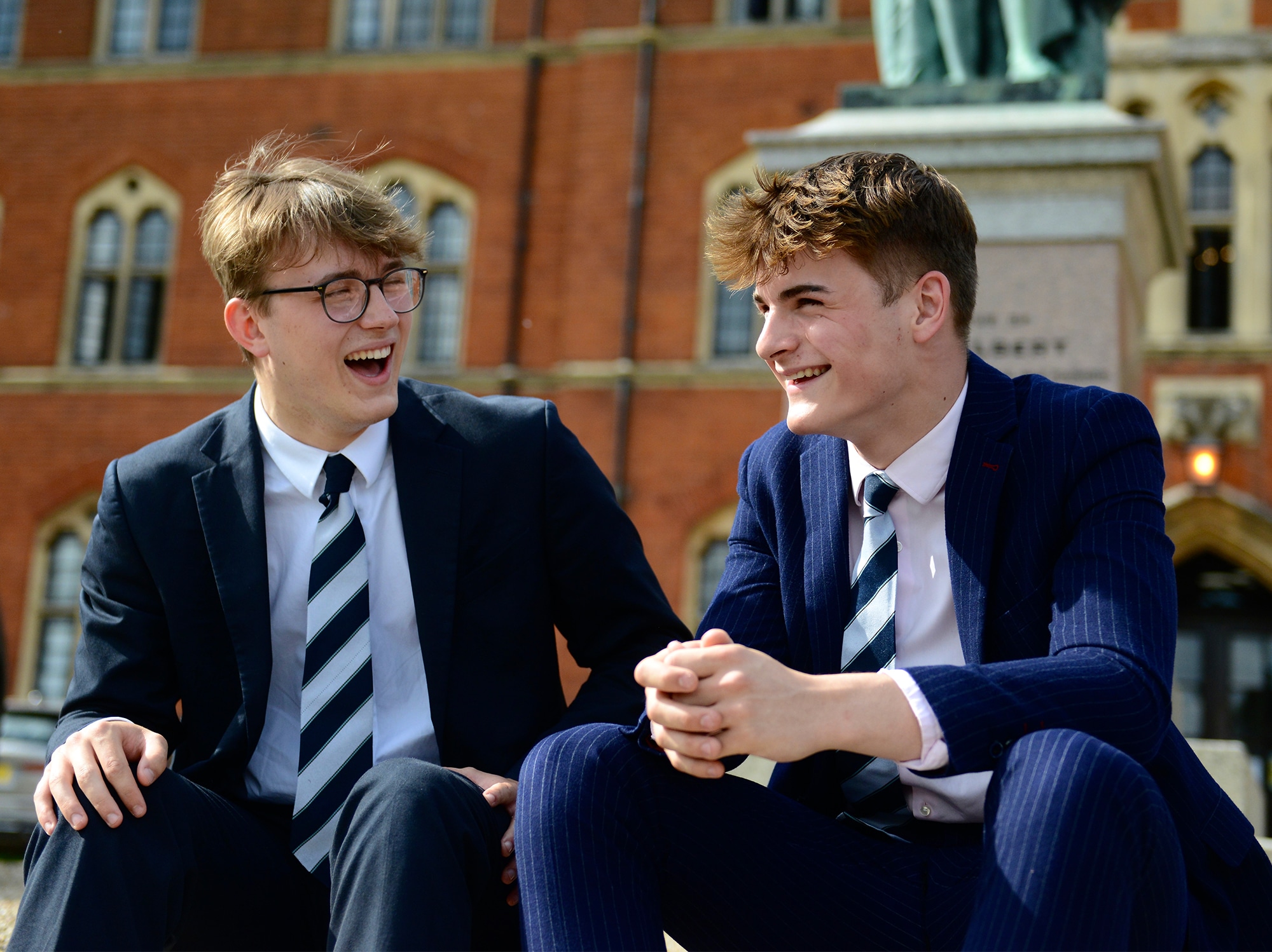 Two Senior school pupils laughing