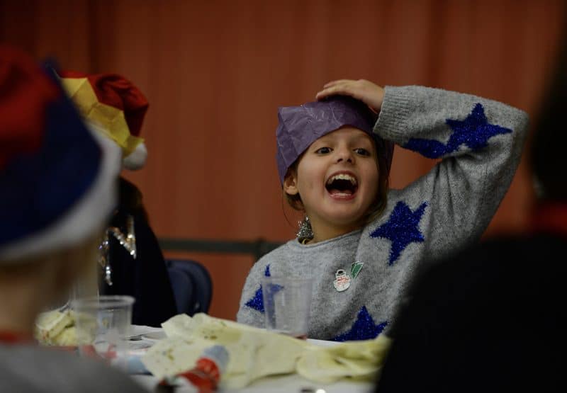 Pupils pull on Christmas Jumpers to eat Christmas lunch together before going separate ways for the holidays